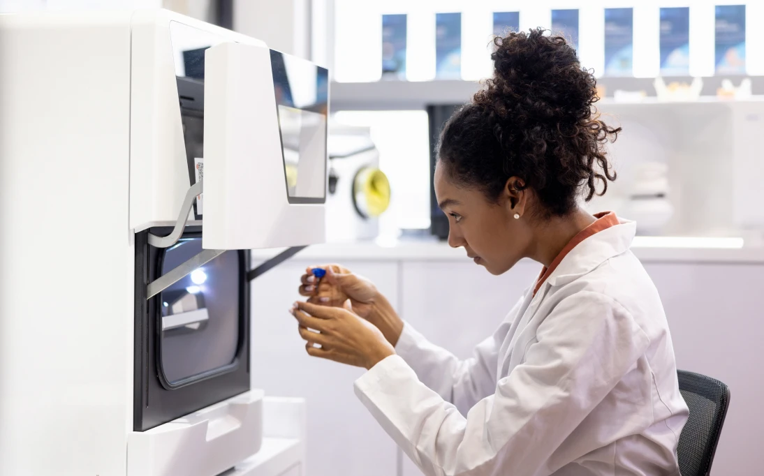 Researcher using scientific instrument