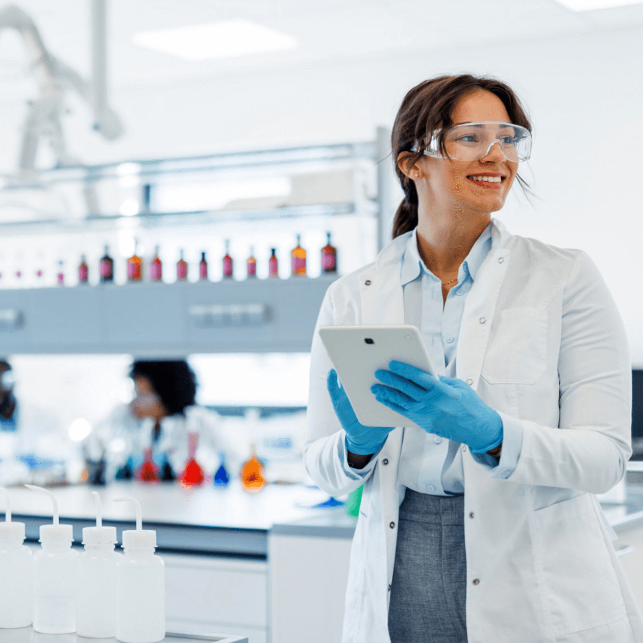 Woman holding tablet in lab