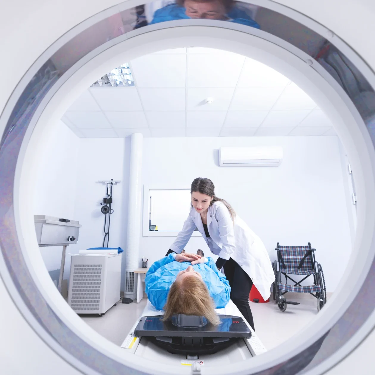 Healthcare worker preparing patient for scan