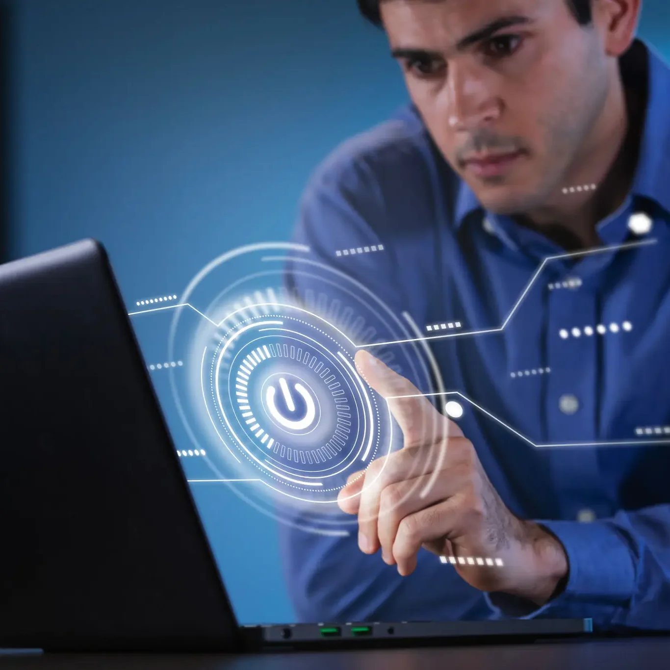 Man interacting with virtual interface on laptop